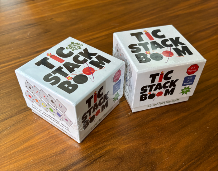 Two Tic Stack Boom game boxes